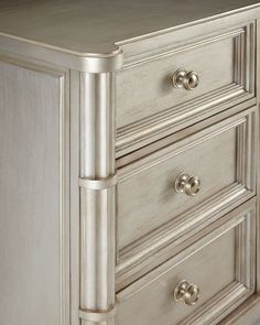 a silver dresser with drawers and knobs on the bottom drawer is shown in this image