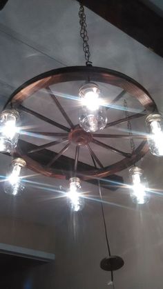 a chandelier with lights hanging from it