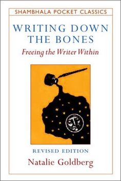 a book cover with the title writing down the bones, written in black and gold