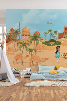 a child's bedroom with a wall mural depicting camels and people in the desert