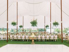 a large tent with tables and chairs set up for an event