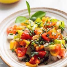 a white plate topped with lots of veggies