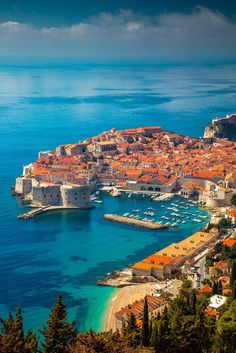 an aerial view of the old town and harbor in dubla d'orcia, italy