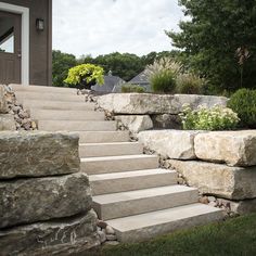 stone steps lead up to the front door of a house