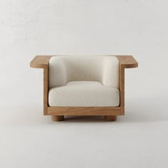 a white chair sitting on top of a wooden table