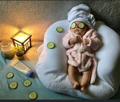 a baby with cucumbers on its face laying on a bean bag