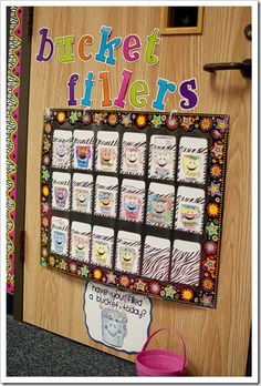 a bulletin board with pictures on it and the words bucket fillers written in large letters