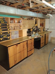 a workbench with lots of drawers and tools