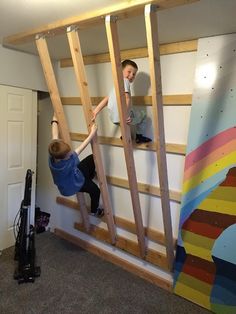 two boys are climbing up the stairs in their room