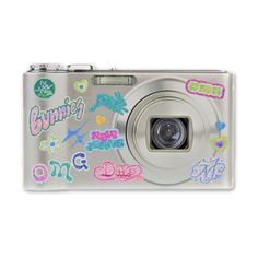 a silver camera with stickers on it