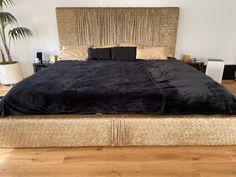 the bed is made up and ready for someone to use it in their home or office