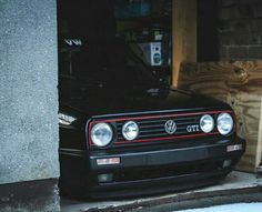 a black car parked in front of a building