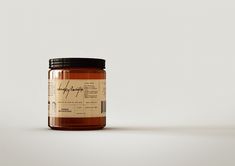 a jar of honey sitting on top of a table