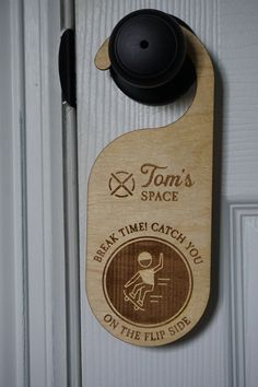 a wooden door hanger that says tom's space available the flip sudd