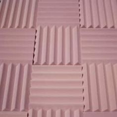 several rows of pink colored tiles stacked on top of each other in the same pattern