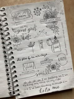 a spiral notebook with writing on it and some pictures in the pages that are handwritten