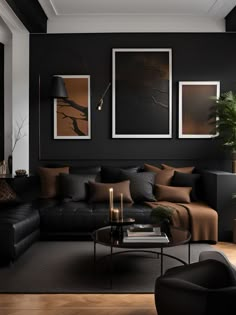 a black and brown living room with pictures on the wall, couches and coffee table