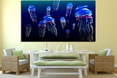 a dining room table with two chairs and a painting on the wall above it depicting jellyfish