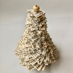 an ornament made out of old book pages