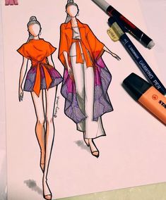 a drawing of a woman's dress and jacket with an orange marker next to it