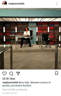 a woman sitting at a desk in an office