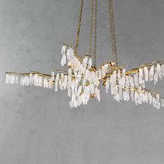 Add natural elegance to your space with the Forest Chandelier from Currey & Company. Hand-forged iron is transformed into a luxurious tree-branch design, adorned with shimmering quartz crystals. The lavish Washed Lucene Gold finish adds a touch of opulence while discreetly placed lamps create a soft, enchanting glow. Highlights Tree-like branches feature hanging quartz crystals Provides softly diffused ambient light Dimmable Some assembly required Available in Washed Lucerne Gold / Natural finish Currey & Company Forest Chandelier in Gold/Clear Forest Chandelier, Branch Chandelier, Architecture Home Design, Forest Light, Post Lanterns, Bar Accessories Decor, Bohemian Coastal, Outdoor Flush Mounts, Some Assembly Required