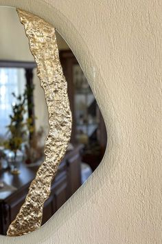 a mirror that is on the side of a wall