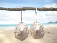 Perfect gift for any ocean lover! `Opihi, a Hawaiian delicacy, is enjoyed raw or grilled. The four species found in Hawai`i are endemic to the islands. Inhabiting remote rocky shorelines, they are resilient and must withstand dry, sun exposure during low tide and crashing waves. Our `Opihi Earrings are perfect reminder that you are resilient and can overcome any obstacle. The artisian made, Hawaiian opihi (limpet) shells were hand cast in sterling silver using the lost wax method. They dangle fr Hawaiian Necklace, Pearl Bangle Bracelet, Beach Wedding Jewelry, Horizontal Bar Necklace, Tahitian Pearl Earrings, Black Freshwater Pearls, Ocean Inspired Jewelry, Beachy Jewelry, Plant Jewelry