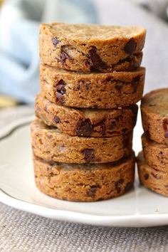 a stack of cookies sitting on top of a white plate