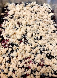 blueberry crumble topping in a metal pan