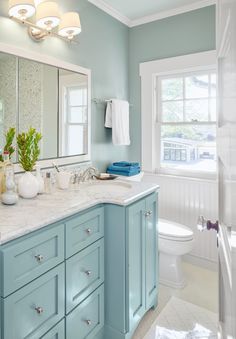 A lively yet restrained paint palette turns a century-old white box into a cheerful family home Coastal Bathrooms, Bathroom Wall Cabinets, Casa Vintage, Blue Cabinets, Beach Bathrooms, Blue Bathroom, Bathroom Colors