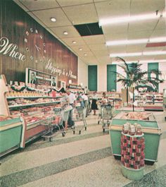 people shopping in a grocery store filled with items