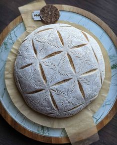 a round cake sitting on top of a blue plate