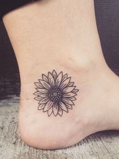 a sunflower tattoo on the ankle is shown in an instagramtion post by @ beautypicc com