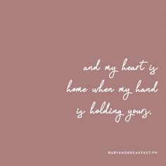 a pink background with white text that says and my heart is home when my hand is holding yours