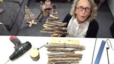 a woman sitting in front of a table filled with woodworking tools and other items