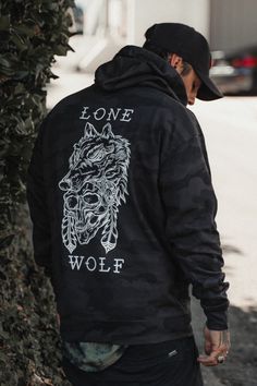 The mythology of the lone wolf stands the test of time. More legend than myth at all, the lone wolf breaks from the pack—by force or possibly necessity—and makes their own way. Territory becomes kingdom for this outsider, and their face instills fear but also reverence. This black camo hoodie reminds you: Alone doesn't mean lonely. Identify your kind with the shameless proclamation: I am a lone wolf. • UNISEX item• Cotton/polyester blend fleece• Ring spun cotton• 55% cotton/45% polyester• Unline Relentless Betrayal, The Lone Wolf, Wolf Black, Camo Hoodie, Mens Fashion Casual Outfits, Lone Wolf, Black Wolf, Black Camo, Cool Hoodies