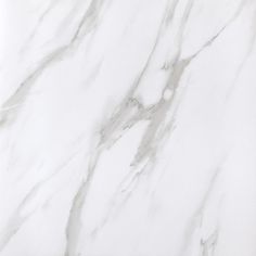 a white marble textured surface with grey veiners