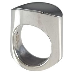 A Danish sterling silver ring, #A110B, designed by Andreas Mikkelsen for Georg Jensen. Stamped Georg Jensen within dotted oval mark, '925 S', 'Denmark', and 'A110B'. The ring is hallmarked with Edinburgh assay marks, and the Common Control Mark '925' to denote sterling silver. Period: - Late 20th Century. Date: - Circa 1970s. Engraving: - Unengraved. Maker: - Georg Jensen. Measurement: - UK ring size M 1/2 (leading edge). US ring size 6 1/4 (leading edge). The face of the ring measures 20.5mm (l George Jensen, La Face, Georg Jensen, Edinburgh, Sterling Silver Ring, Fashion Rings, Denmark, Statement Rings, 20th Century