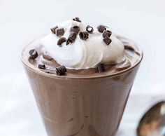 a chocolate drink with whipped cream and chocolate chips