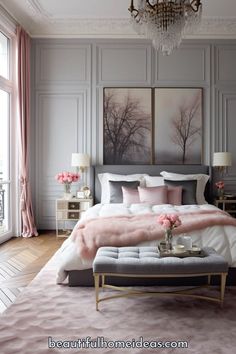 a bedroom decorated in pink and grey with a chandelier hanging above the bed