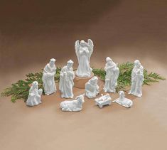 a group of white figurines sitting on top of a table