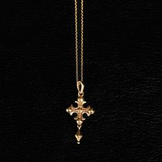 A fusion of medieval aesthetics and tragic beauty, this piece reflects faith's role as a guide through the material world. A tool for divine connection, it embodies reverence while transcending the ordinary. The intricately designed cross, adorned with fleur-shaped extremities, evokes both elegance and the timeless power of protective talismans.  Design: by NOIR KĀLA Material: Brass Size: 1.8 cm x 3 cm Weight: 2 g Tragic Beauty, Medieval Aesthetics, Ear Cuff Piercing, Snake Charmer, Divine Connections, Material World, Image Model, Cross Jewelry, Cross Pendant Necklace