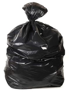 a large black trash bag sitting on top of a white floor