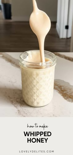 whipped honey being poured into a jar with the words how to make whipped honey in it