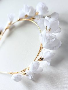 This beautiful bridal tiara has been crafted out of white chiffon fabric roses (each rose has been handmade), adorned with gold plated petal cap beads. This gorgeous headpiece adds elegant accent to floral, romantic bridal gowns. - Measures approx. 4.5cm at its highest point - Handmade in my UK studio Matching Items EARRINGS: https://www.etsy.com/uk/listing/1301787490/boho-bridal-earrings-handmade-freshwater https://www.etsy.com/uk/listing/1315769849/bridal-pearl-drop-earrings-pearl-cluster https://www.etsy.com/uk/listing/1312428843/925-sterling-silver-gold-plated https://www.etsy.com/uk/listing/1301704206/white-porcelain-clay-flower-swarovski https://www.etsy.com/uk/listing/1148965849/wedding-pearl-gold-flower-petals https://www.etsy.com/uk/listing/1114968515/wedding-gold-fan-rhinestones- Wedding White Roses, White Chiffon Fabric, Floral Bridal Hair Accessories, Bridal Floral Hair, Floral Hair Accessories, Bridal Flower Headband, Tiara Gold, Bridal Hair Accessories Flower, Floral Tiara