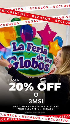 a woman holding up a sign with the words la feria de colores on it