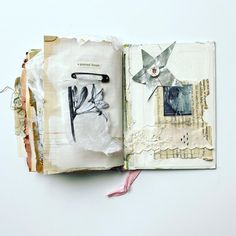 an open book with paper and scissors on the pages, which have been altered to look like flowers