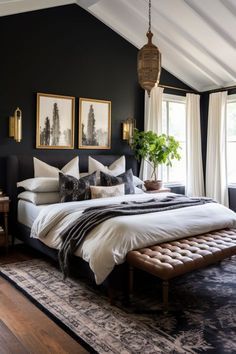 a bedroom with black walls, white bedding and wooden flooring is pictured in this image