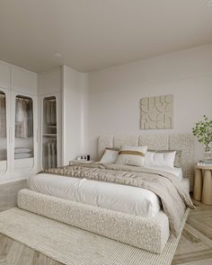 a large bed sitting in the middle of a bedroom next to a tall white cabinet